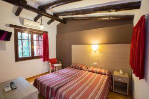 Postel nebo postele na pokoji v ubytování Hotel - Bungalows Don Juan Tossa