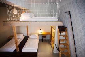 Postel nebo postele na pokoji v ubytování Michelberger Hotel