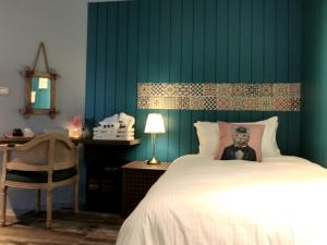 Ένα ή περισσότερα κρεβάτια σε δωμάτιο στο 沐日海邊民宿