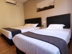 Rúm í herbergi á The Core Hotel