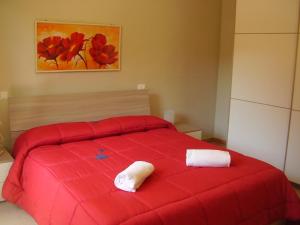 Кровать или кровати в номере Appartamenti Easy Time