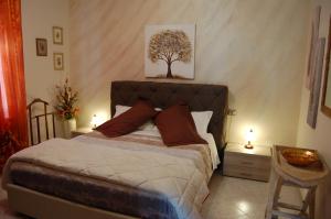 En eller flere senge i et værelse på Appartamenti Donato