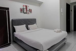 Postel nebo postele na pokoji v ubytování Modern Studio Casa De Parco Apartment By Travelio + 7 fotografií