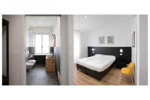 Postel nebo postele na pokoji v ubytování ParcoSantaTeresa Suites LOC-02279