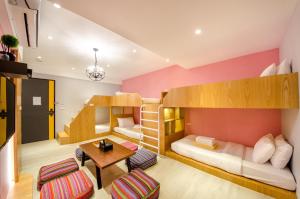 Postel nebo postele na pokoji v ubytování 安尼赫時尚旅店 Anich Fashion Inn I 墾丁大街 I 親子遊戲區 I 停車位 + 37 fotografií