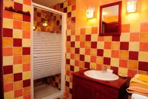 a bathroom with a sink and a shower at Clos du Veyrier in Bédoin +40 photos