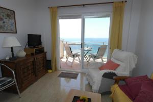 a living room with a view of the ocean at MB, Mareta Blava, piscina y vistas in Era de Soler