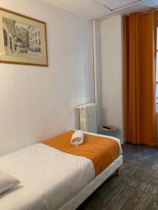 Postel nebo postele na pokoji v ubytování Hotel de Bretagne