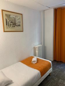 Postel nebo postele na pokoji v ubytování Hotel de Bretagne
