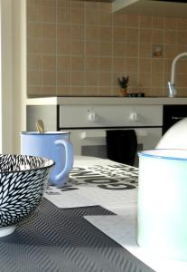 a kitchen with a counter with a sink and a bowl at Apartman VICINIM family friendly in Višnjan