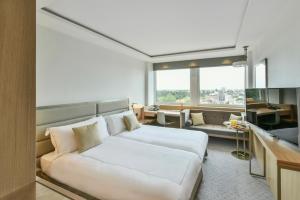 A bed or beds in a room at Royal Lancaster London 