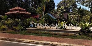 關丹的住宿－Tanjung Inn，公园里读塔米尔旅馆的一个标志