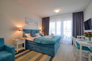 Posteľ alebo postele v izbe v ubytovaní Apartamenty Onyx SeaView by Rent like home
