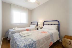 Łóżko lub łóżka w pokoju w obiekcie ALTAMAR Sunny Home by Cadiz4Rentals