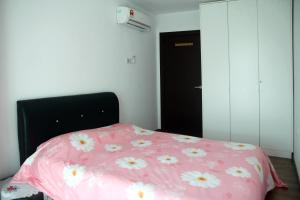 Кровать или кровати в номере Vivacity Jazz Suites Condominium