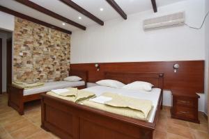 Letto o letti in una camera di Hotel Galeb