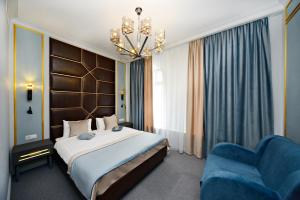Ein Bett oder Betten in einem Zimmer der Unterkunft Design Hotel Senator