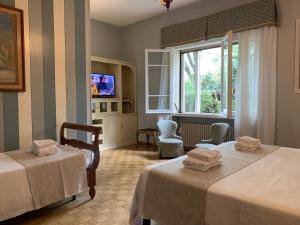 Ліжко або ліжка в номері Hotel David