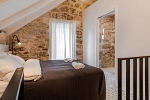 Posteľ alebo postele v izbe v ubytovaní No.5 Luxury Studio