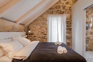 Posteľ alebo postele v izbe v ubytovaní No.5 Luxury Studio