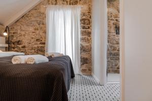 Posteľ alebo postele v izbe v ubytovaní No.5 Luxury Studio