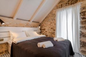 Posteľ alebo postele v izbe v ubytovaní No.5 Luxury Studio