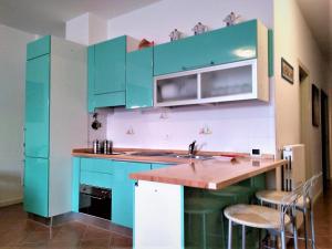 Kuchyň nebo kuchyňský kout v ubytování Residence La Pianotta 2