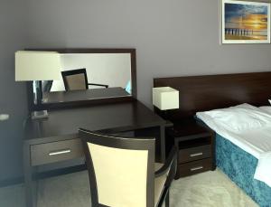 Łóżko lub łóżka w pokoju w obiekcie Apartament Tit Aquarius Spa