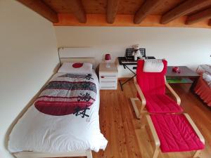 a bedroom with a bed and a desk and a chair at Casa Dolce Casa in Valdobbiadene