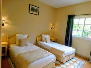 Postel nebo postele na pokoji v ubytování Hotel Le Cilaos