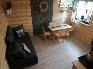 a living room with a couch and a table at U Siuhajów in Frydman
