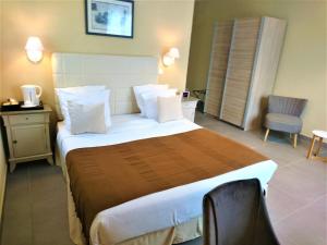 Postel nebo postele na pokoji v ubytování Hotel Le Cilaos