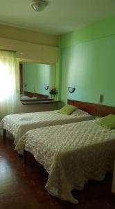 Ένα ή περισσότερα κρεβάτια σε δωμάτιο στο Aparthotel Avenida