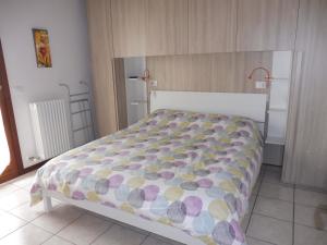 Giường trong phòng chung tại Villaggio Laguna app.to 5 e 38 +26 ảnh