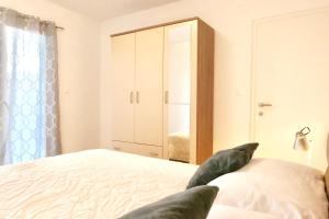 Posteľ alebo postele v izbe v ubytovaní Antonia Apartments