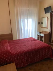Postel nebo postele na pokoji v ubytování Hotel Flamingo