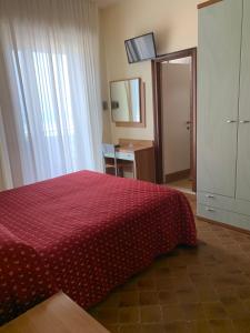 Postel nebo postele na pokoji v ubytování Hotel Flamingo