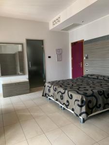 Postel nebo postele na pokoji v ubytování Hotel Flamingo + 18 fotografií