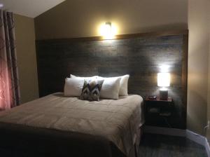Voodi või voodid majutusasutuse Villegiature Deux Rivieres Resort toas