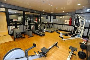 an image of a gym with cardio equipment in it at Lyons Woodlands Hall in Ruthin