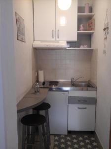 Kuchyň nebo kuchyňský kout v ubytování Apartments Teo 1