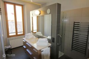 a bathroom with a sink and a shower at StellaHome - La petite cour in Sanary-sur-Mer +30 photos