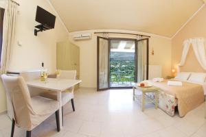 מיטה או מיטות בחדר ב-Minas Apartments