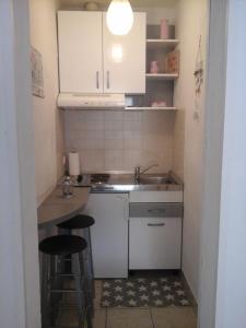Kuchyň nebo kuchyňský kout v ubytování Apartments Teo 1