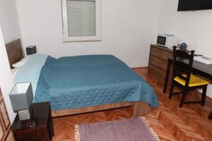 Posteľ alebo postele v izbe v ubytovaní Apartman Kupa