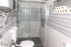 Kúpeľňa v ubytovaní Apartman Kupa