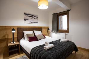 Ένα ή περισσότερα κρεβάτια σε δωμάτιο στο TERRESENS - Le Diamant des Neiges