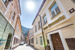 a street in an old town with buildings at Casa Atanasiu -Adult only in Braşov