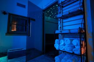 a blue room with a shelf with blue candles at Fogajard Lovely Chalet in Madonna di Campiglio +104 photos