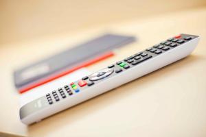 a remote control sitting on top of a table at Hotel Post in Weiden